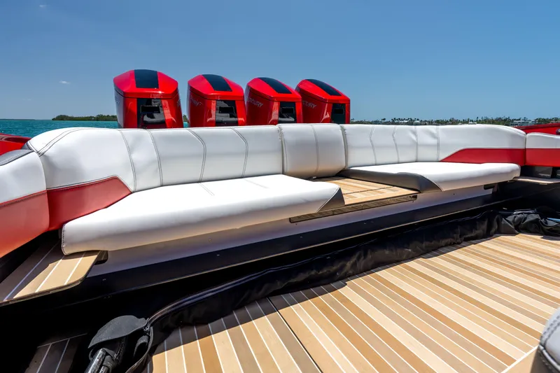 Slide: The Image of Luxurious seating on 2023 Nor-Tech 55 Flyer boat with powerful red engines. - 27