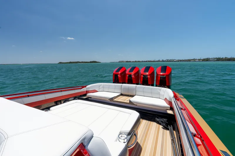 Slide: The Image of 2023 Nor-Tech 55 Flyer boat with red engines on open water. - 29