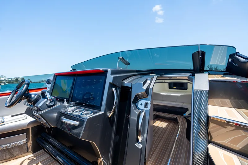 Slide: The Image of Interior view of 2023 Nor-Tech 55 Flyer yacht cockpit with modern controls and seating. - 40