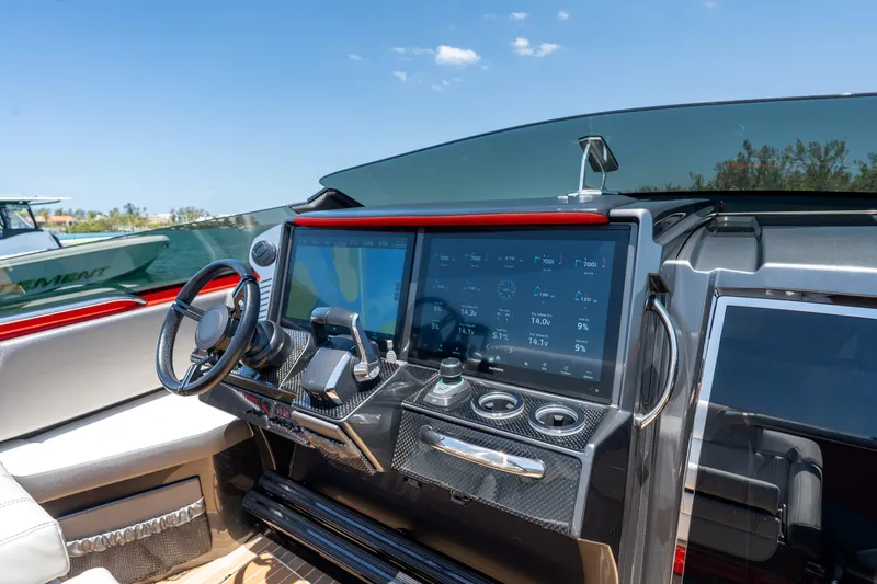 Slide: The Image of 2023 Nor-Tech 55 Flyer dashboard with advanced navigation and control systems. - 42