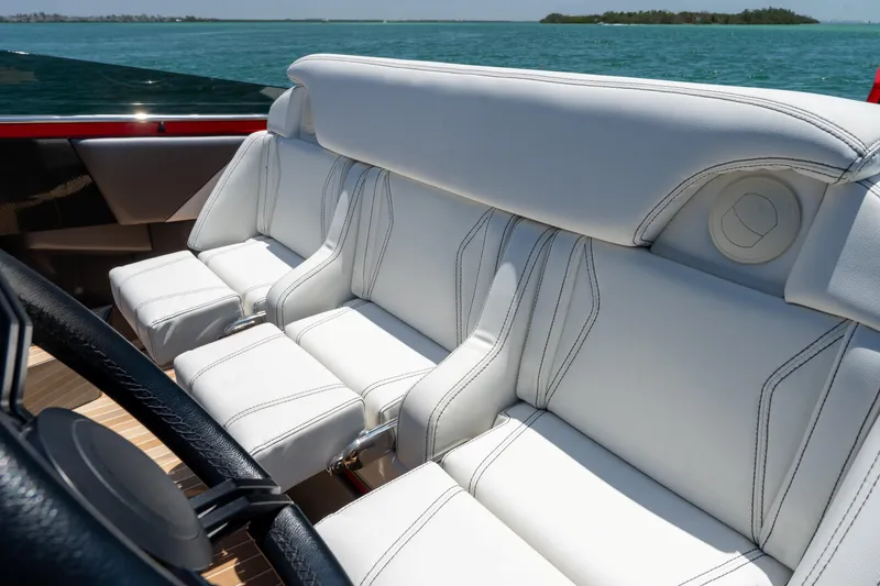 Slide: The Image of Luxurious white seating on 2023 Nor-Tech 55 Flyer boat with ocean view. - 45