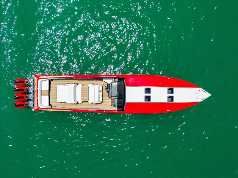 Slide: The Image of Aerial view of 2023 Nor-Tech 55 Flyer boat on vibrant green water. - 9