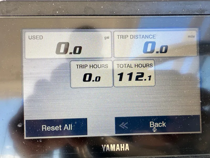 Slide: The Image of Display screen of a 2022 Robalo R247 Dual Console showing 112.1 total hours. - 16