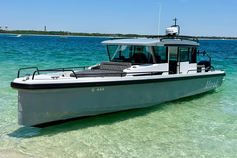 The Image of 2019 Axopar 37 XC Cross Cabin boat on clear turquoise water. - 0
