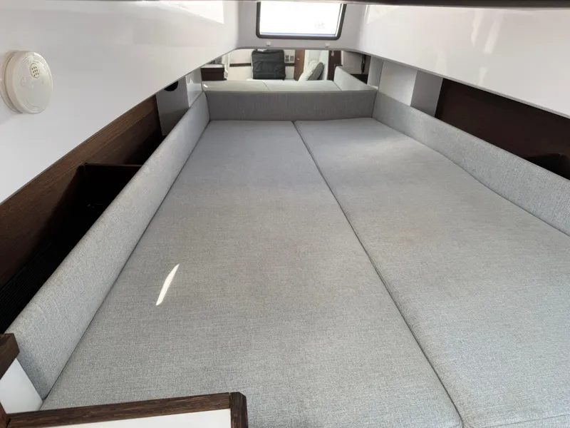 Slide: The Image of 2019 Axopar AX37XC cabin interior with spacious gray seating area. - 14