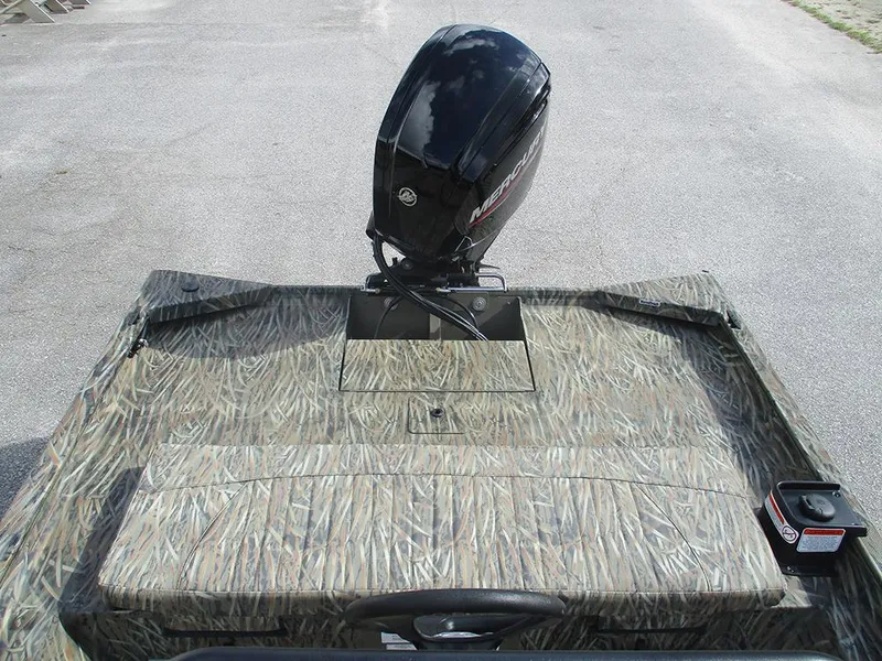 Slide: The Image of 2026 Tracker Grizzly 1860 CC boat with camo design and Mercury outboard motor. - 16