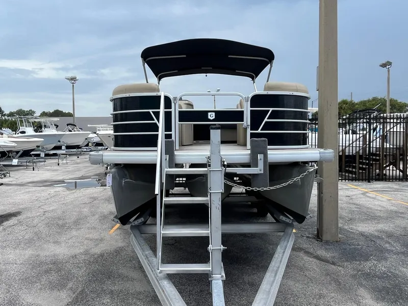 Slide: The Image of 2022 Godfrey Sweetwater 2286 FS pontoon boat on trailer at dealership. - 2
