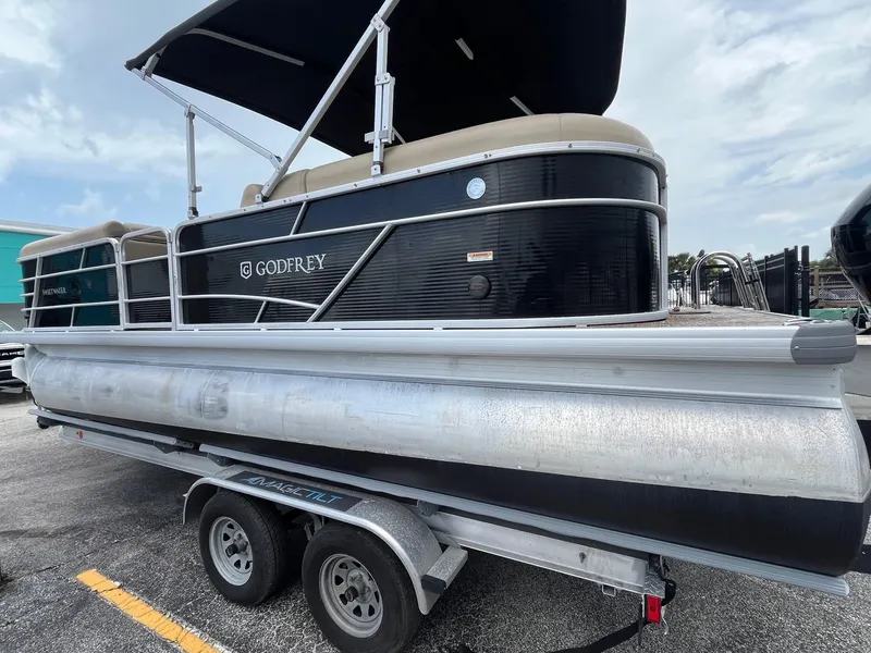 Slide: The Image of 2022 Godfrey Sweetwater 2286 FS pontoon boat on trailer, side view. - 4