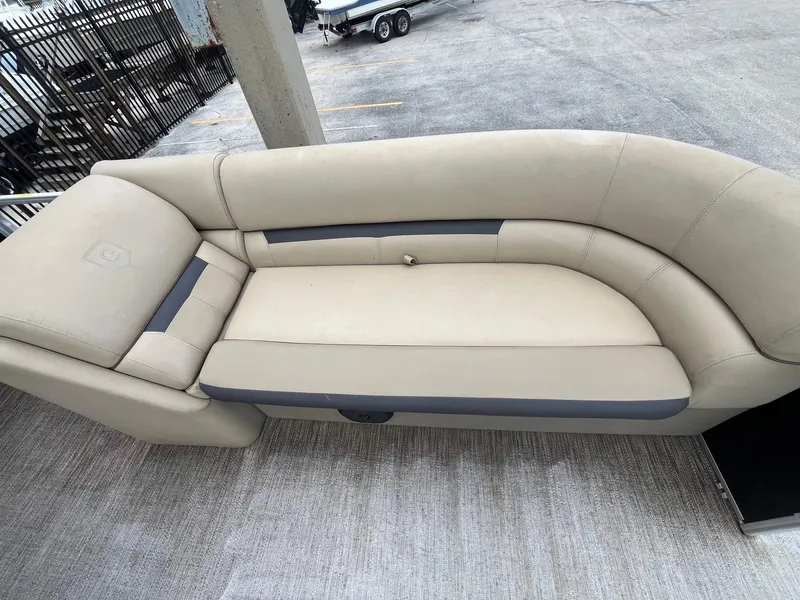 Slide: The Image of 2022 Godfrey Sweetwater 2286 FS boat seating, beige upholstery, spacious and comfortable design. - 9