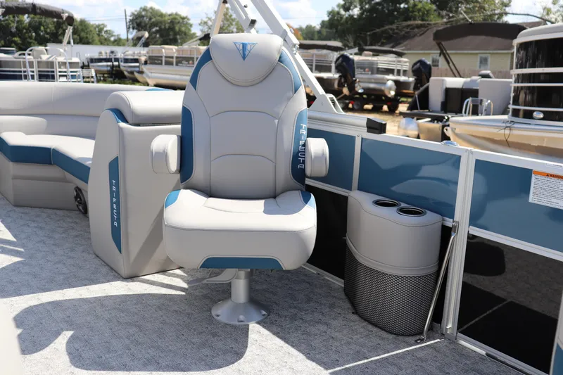Slide: The Image of Captain's chair on 2025 Trifecta LE Series 24RF LE pontoon boat, featuring blue and gray upholstery. - 6