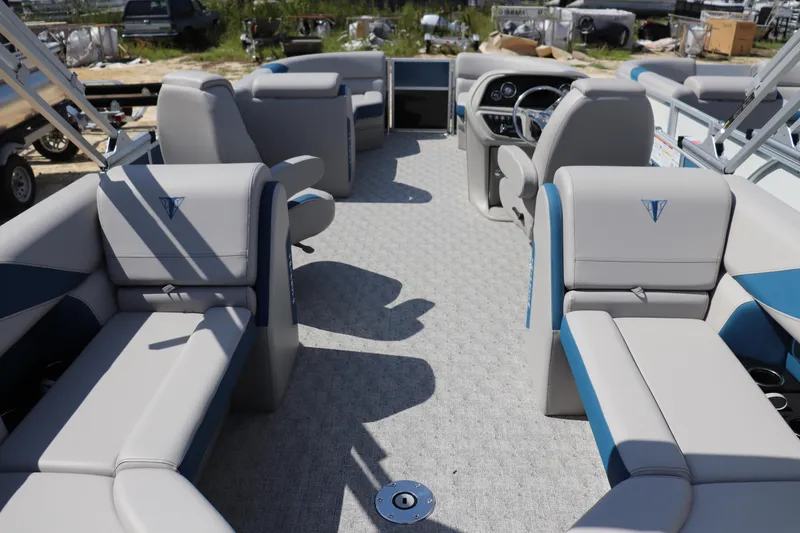 Slide: The Image of 2025 Trifecta LE Series 24RF LE pontoon boat interior with plush seating and modern dashboard. - 9