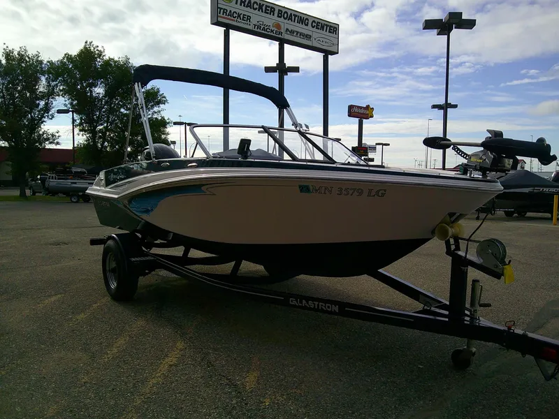 Slide: The Image of 2015 Glastron GT 180 Ski & Fish boat on trailer in parking lot. - 3