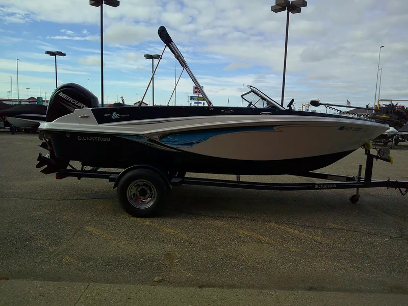 Slide: The Image of 2015 Glastron GT 180 Ski & Fish boat on trailer in parking lot. - 4