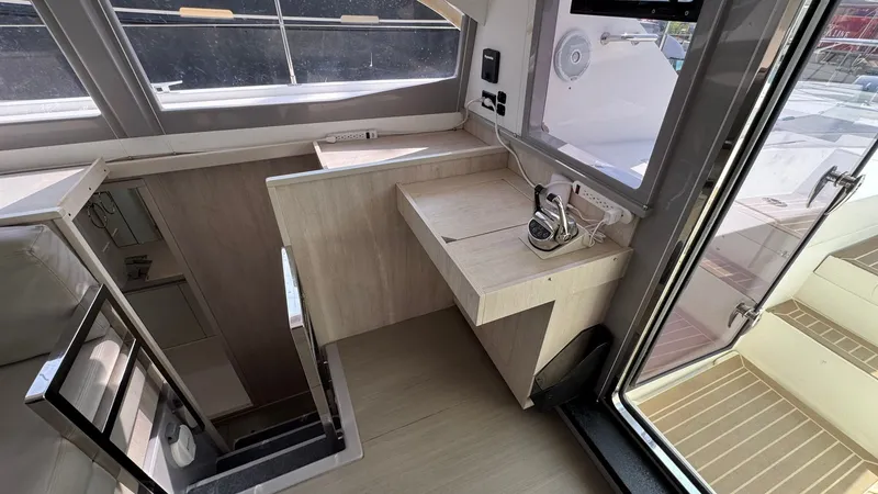 Slide: The Image of 2018 Leopard Power Cat Dinette Storage facing aft - 23