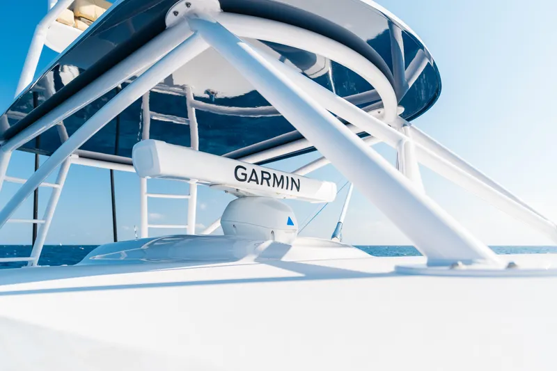 Slide: The Image of 2026 Phenom 43 Center Console with Garmin radar, ocean backdrop. - 10