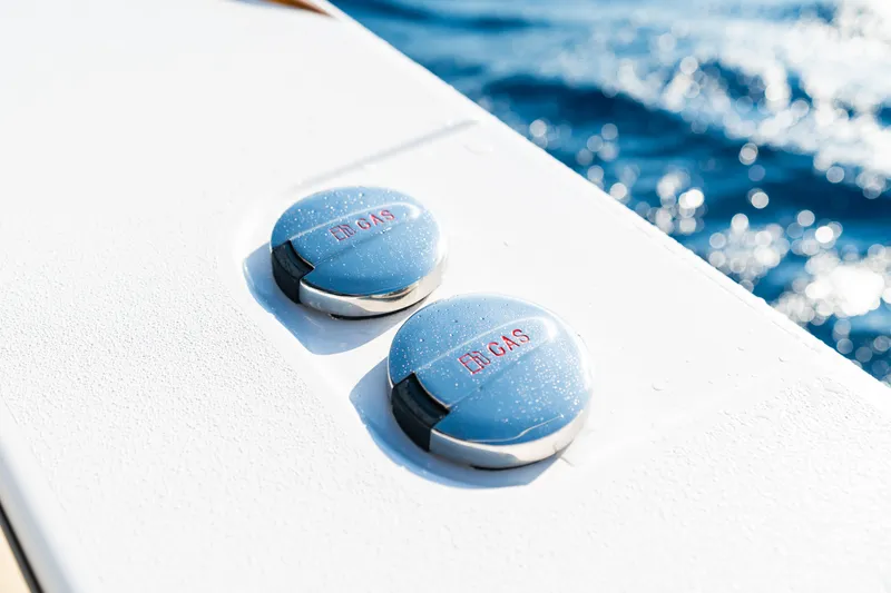 Slide: The Image of Fuel caps on 2026 Phenom 43 Center Console boat, ocean background. - 12