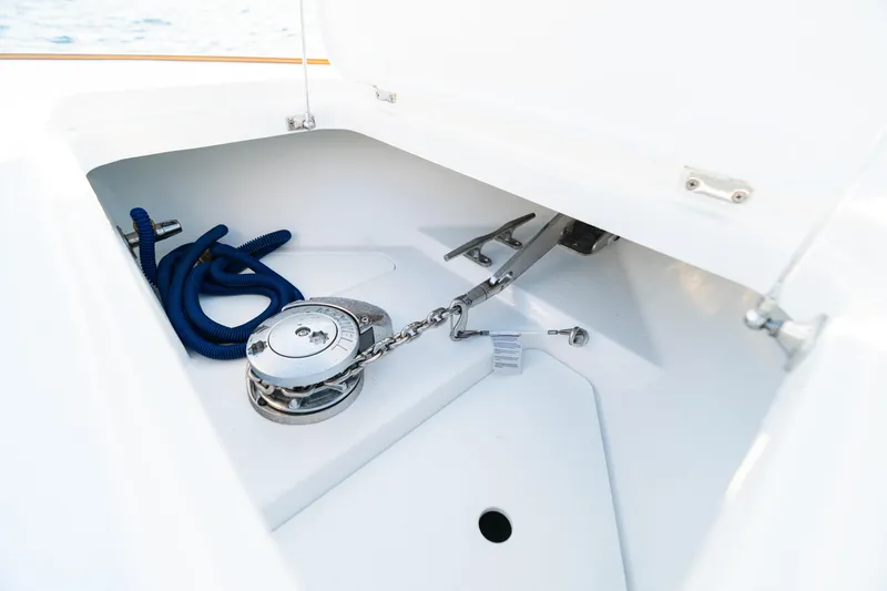 Slide: The Image of Anchor compartment of 2026 Phenom 43 Center Console with blue rope and chain. - 13