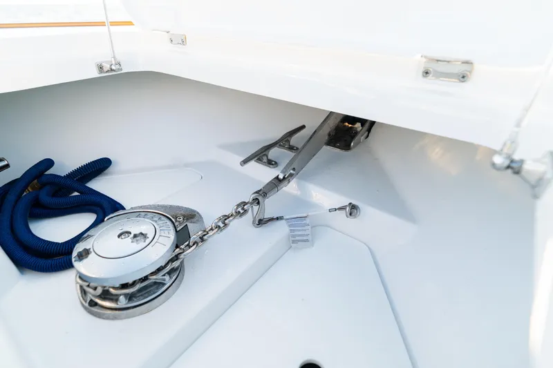 Slide: The Image of Anchor compartment of 2026 Phenom 43 Center Console boat with chain and rope. - 14