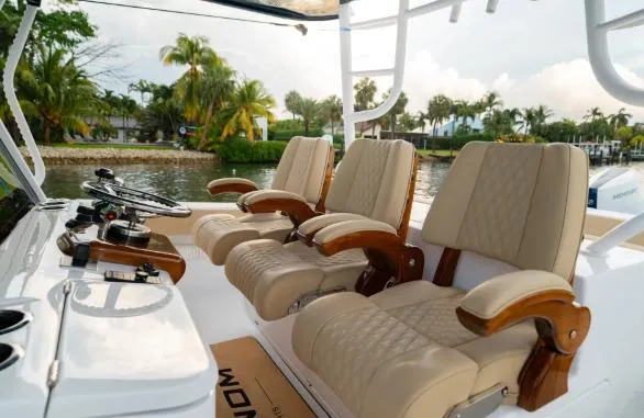 Slide: The Image of 2026 Phenom 43 Center Console boat with luxurious seating and modern controls. - 4