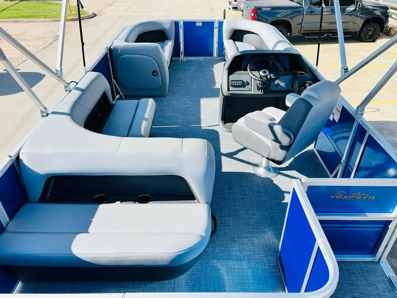 Slide: The Image of 2026 Sun Tracker Party Barge 18 DLX interior with spacious seating and modern helm. - 10