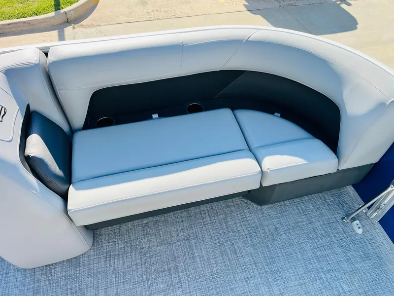 Slide: The Image of 2026 Sun Tracker Party Barge 18 DLX, featuring comfortable seating and cup holders. - 14