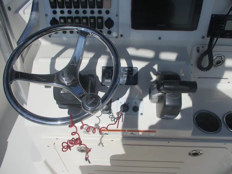 Slide: The Image of 2008 Hydra-Sports 23 Bay Bolt boat dashboard with steering wheel and controls. - 10