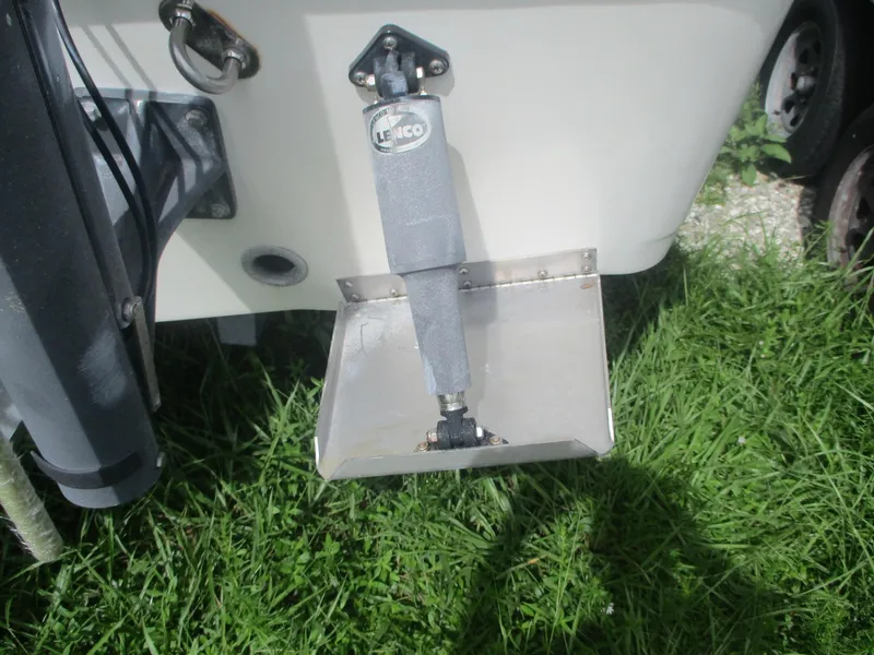 Slide: The Image of 2008 Hydra-Sports 23 Bay Bolt boat with Lenco trim tab on grassy surface. - 19