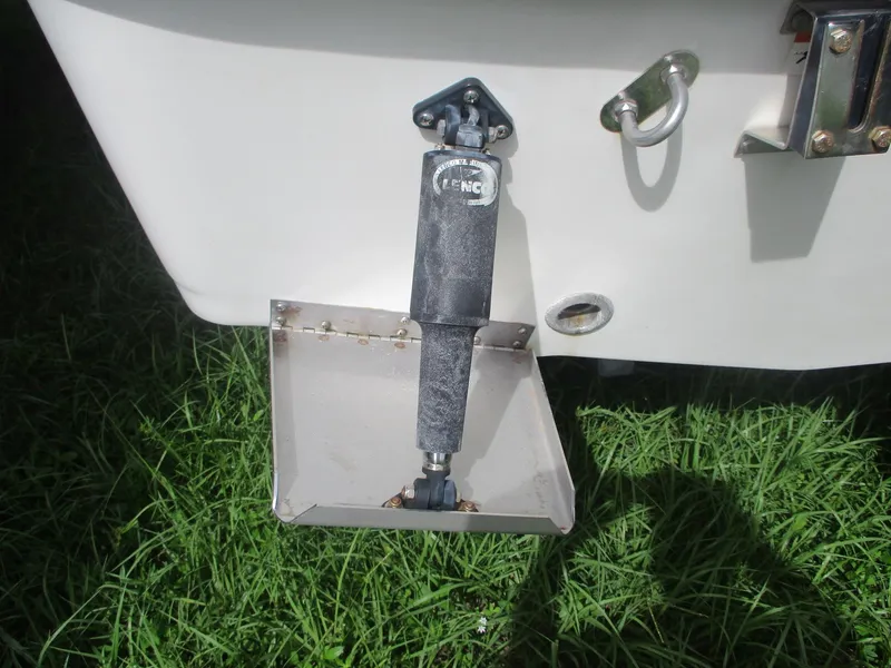 Slide: The Image of 2008 Hydra-Sports 23 Bay Bolt trim tab on grassy surface. - 22