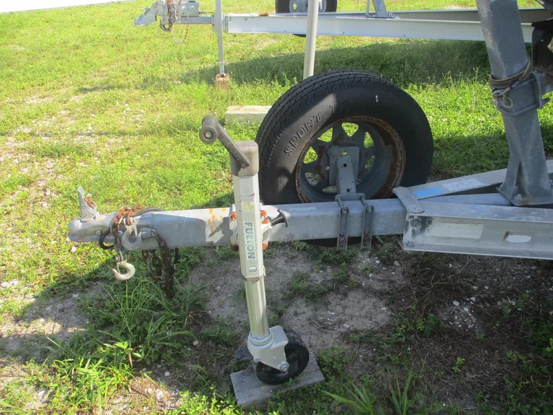 Slide: The Image of Trailer hitch and wheel of a 2008 Hydra-Sports 23 Bay Bolt on grass. - 3