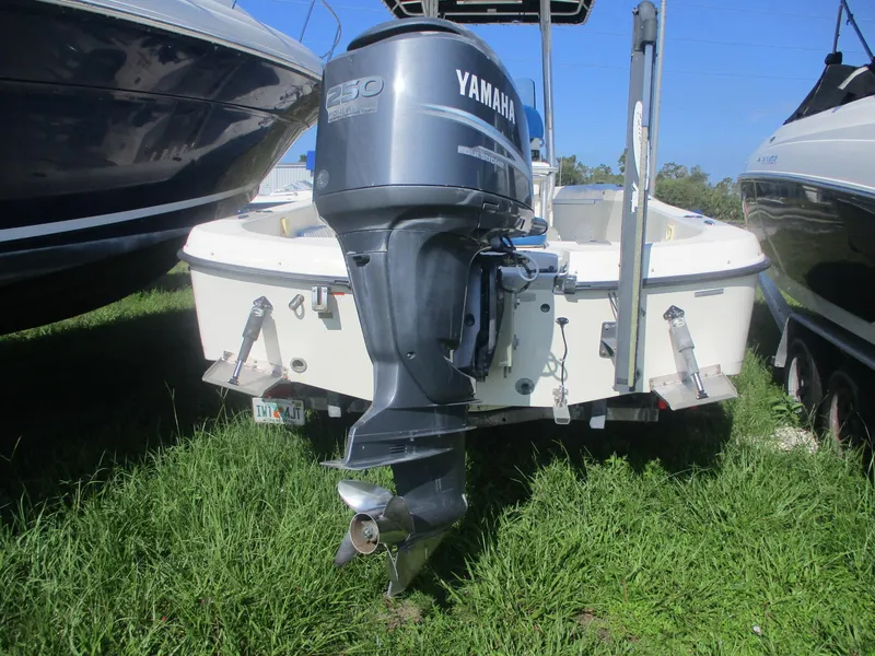 Slide: The Image of 2008 Hydra-Sports 23 Bay Bolt boat with Yamaha 250 outboard motor, parked on grass. - 4