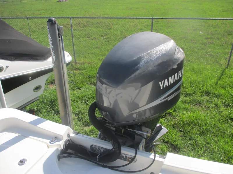 Slide: The Image of 2008 Hydra-Sports 23 Bay Bolt with Yamaha outboard motor in grassy area. - 5