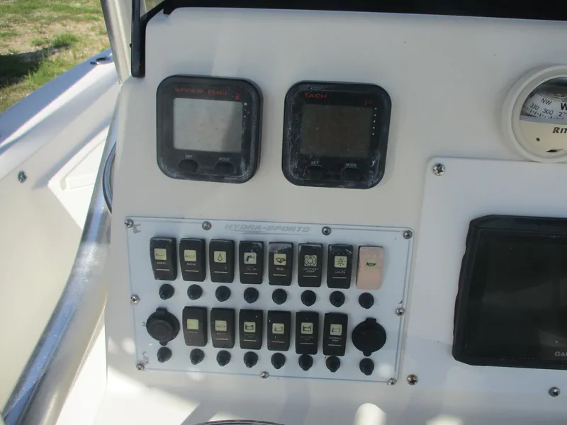 Slide: The Image of 2008 Hydra-Sports 23 Bay Bolt dashboard with gauges and control panel. - 7