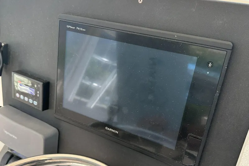 Slide: The Image of Garmin GPS display on 2005 Rampage 30 Express boat dashboard. - 12