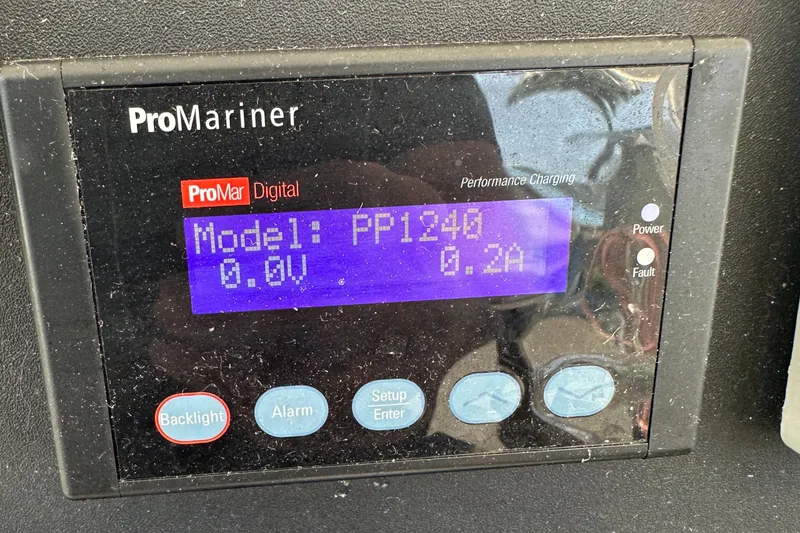 Slide: The Image of ProMariner digital display on 2005 Rampage 30 Express, showing model PP1240, 0.0V, 0.2A. - 16