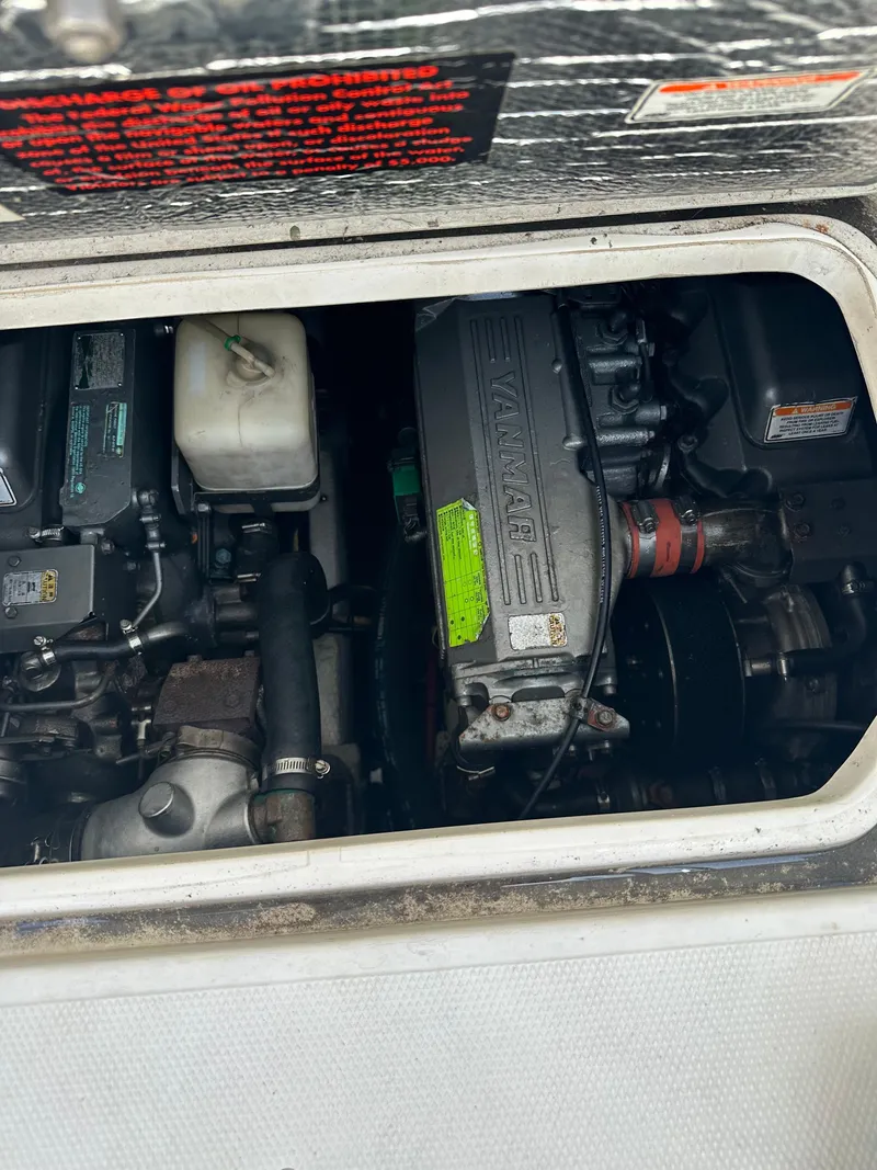 Slide: The Image of Engine compartment of a 2005 Rampage 30 Express boat, featuring a Yanmar engine. - 5