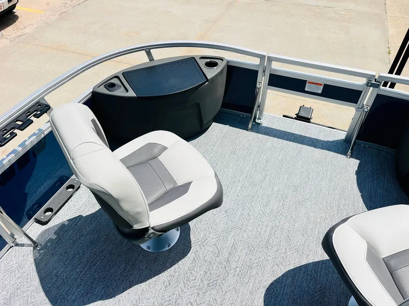 Slide: The Image of 2026 Sun Tracker Bass Buggy 18 DLX pontoon boat interior with seating and console. - 12