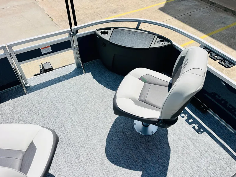 Slide: The Image of 2026 Sun Tracker Bass Buggy 18 DLX interior with seating and storage. - 14