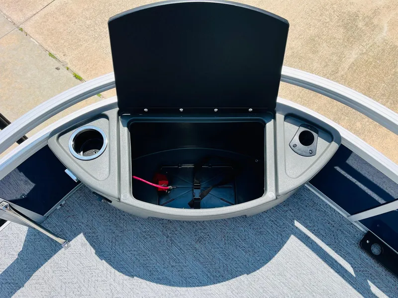 Slide: The Image of Open storage compartment on 2026 Sun Tracker Bass Buggy 18 DLX boat deck. - 15