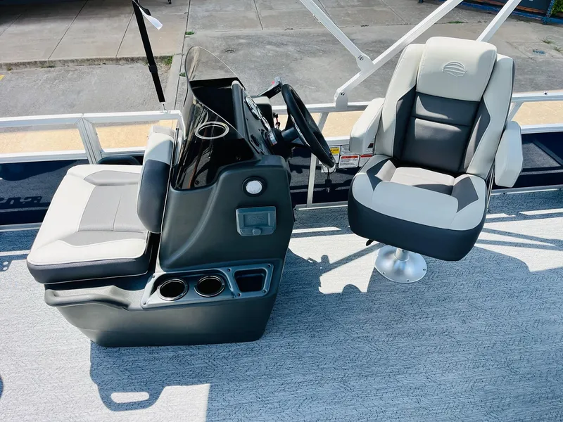 Slide: The Image of 2026 Sun Tracker Bass Buggy 18 DLX interior with steering console and seating. - 20