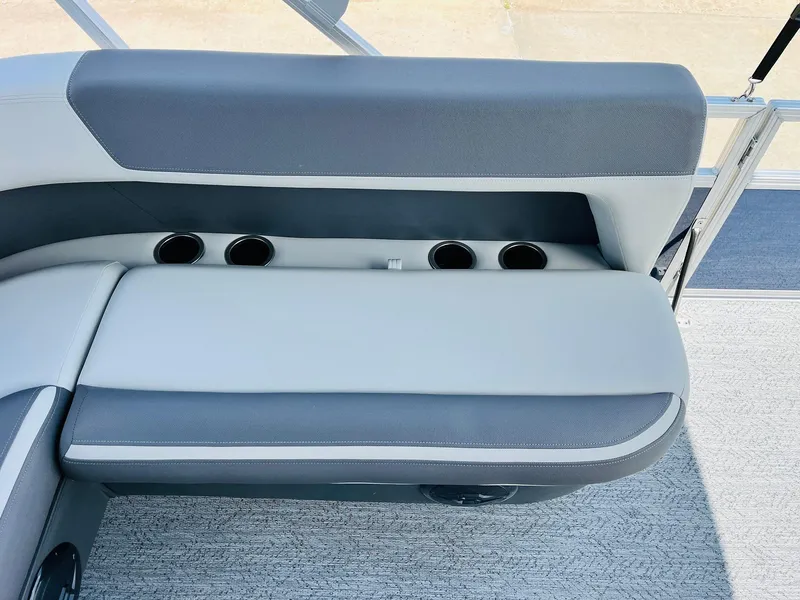 Slide: The Image of 2026 Sun Tracker Bass Buggy 18 DLX boat seat with cup holders and gray upholstery. - 24