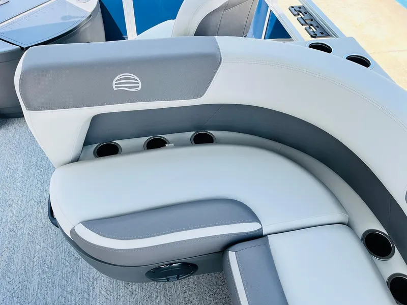 Slide: The Image of 2026 Sun Tracker Bass Buggy 18 DLX boat seating with cup holders and modern design. - 25