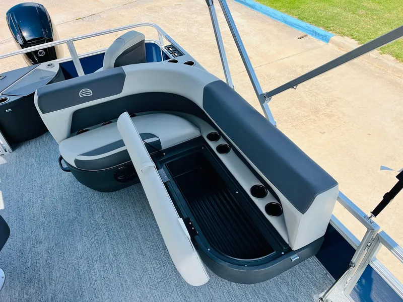 Slide: The Image of 2026 Sun Tracker Bass Buggy 18 DLX interior with seating and storage compartments. - 26