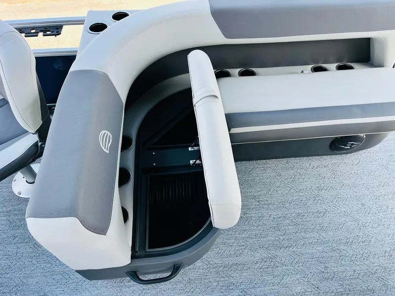 Slide: The Image of 2026 Sun Tracker Bass Buggy 18 DLX boat seating with storage and cup holders. - 27