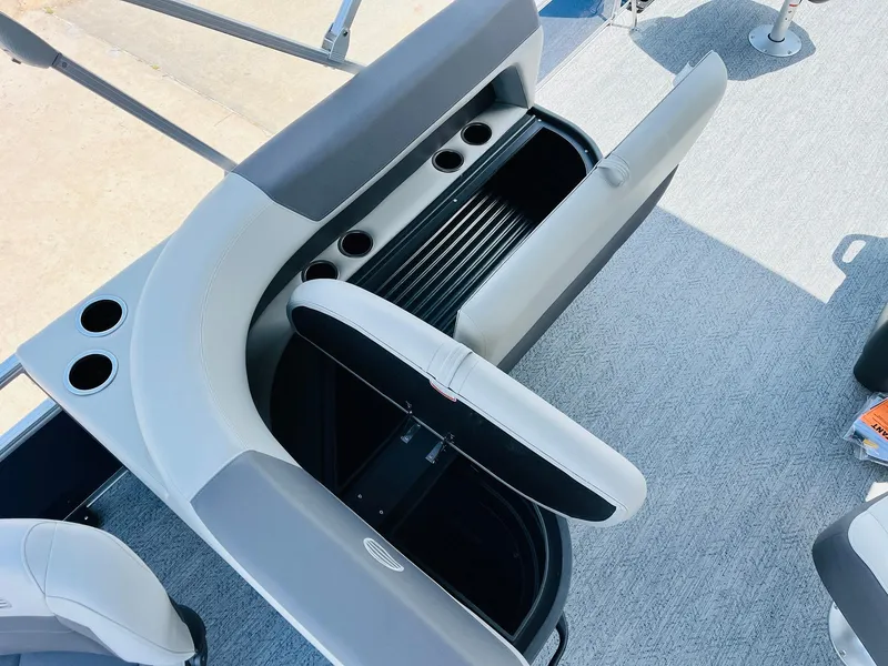 Slide: The Image of 2026 Sun Tracker Bass Buggy 18 DLX interior with seating and storage compartments. - 28