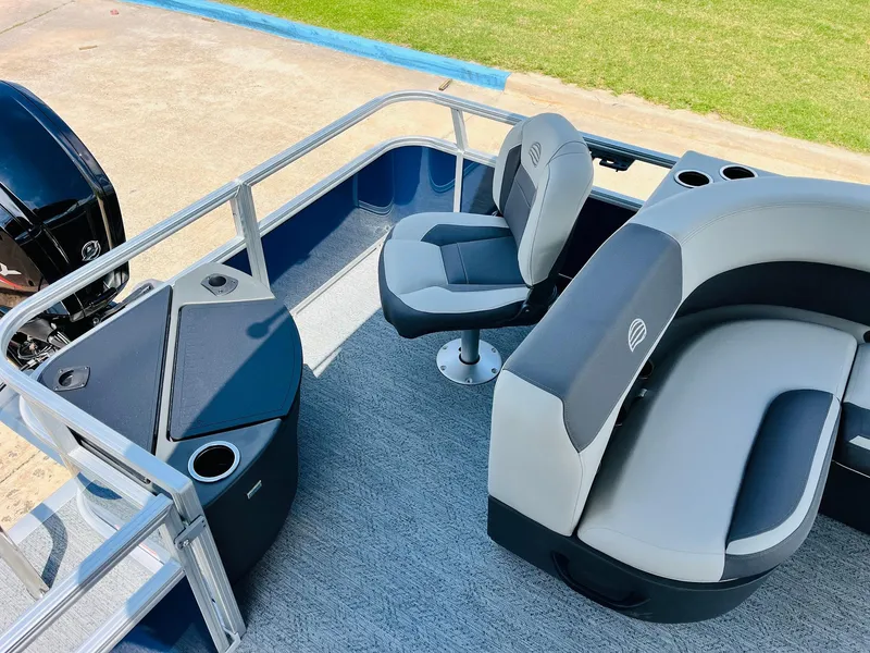 Slide: The Image of 2026 Sun Tracker Bass Buggy 18 DLX interior with seating and storage compartments. - 29