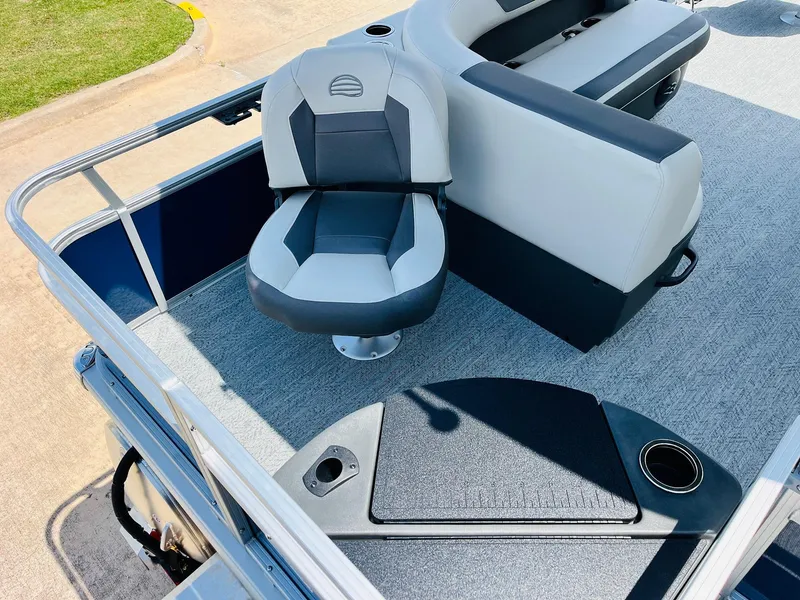 Slide: The Image of 2026 Sun Tracker Bass Buggy 18 DLX boat interior with seating and cup holder. - 30