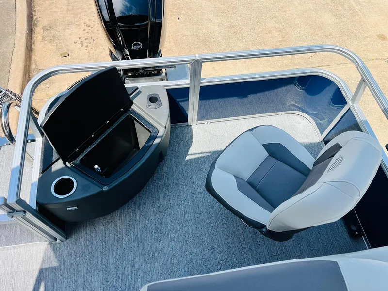 Slide: The Image of 2026 Sun Tracker Bass Buggy 18 DLX interior with seating and storage compartment. - 31