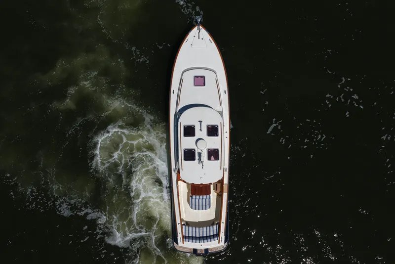 Slide: The Image of Aerial view of 2005 Hinckley 36 yacht cruising on dark water. - 16