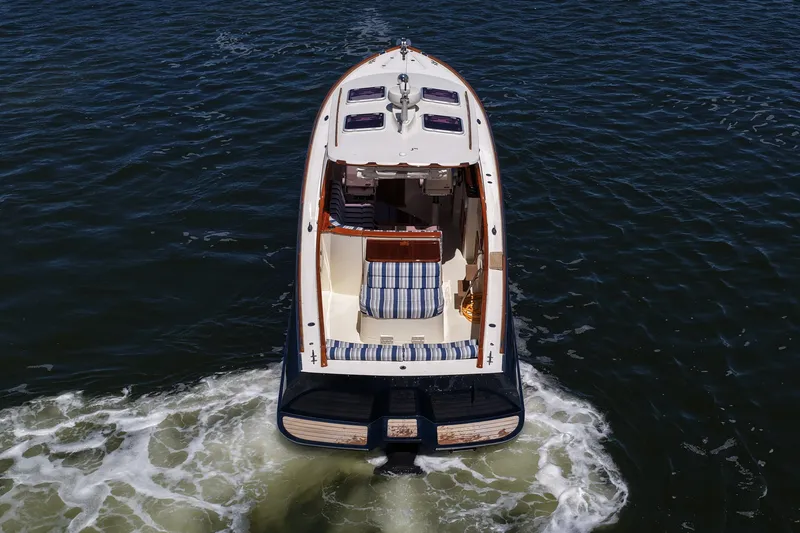 Slide: The Image of Hinckley 36 boat from 2005 cruising on open water, aerial view. - 17
