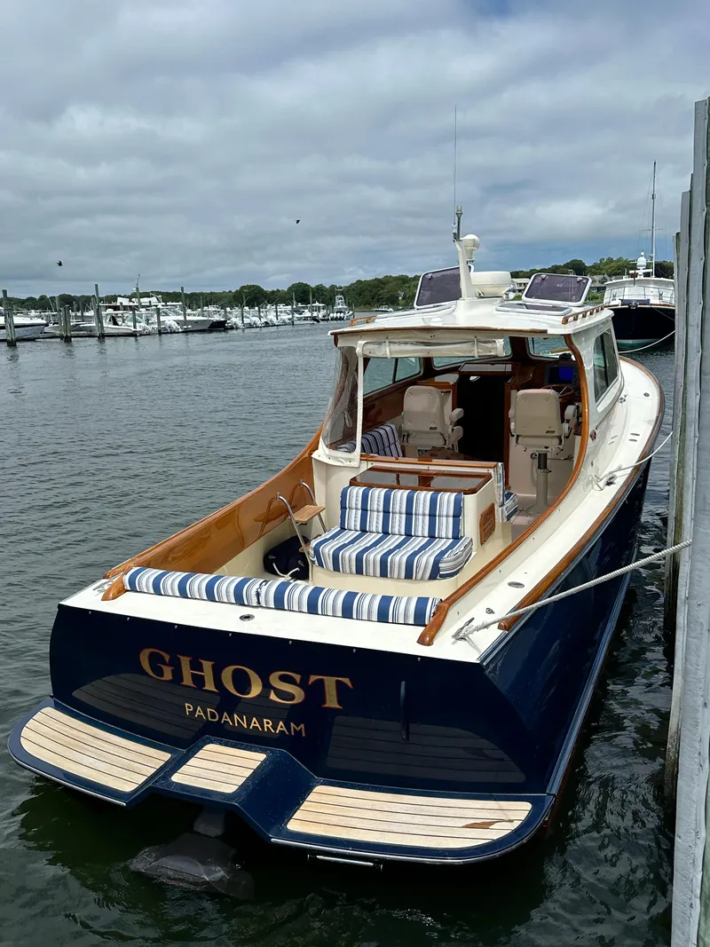 Slide: The Image of Hinckley 36 yacht, 2005 model, docked with striped seating, named "Ghost" in Padanaram. - 20